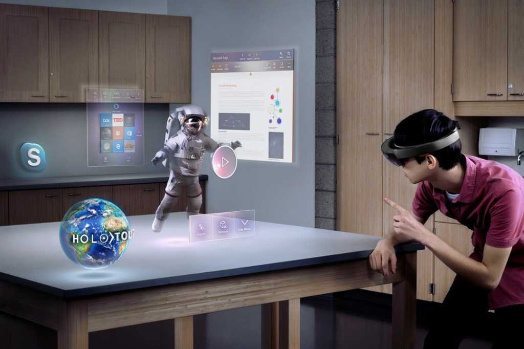 A man wearing a Microsoft HoloLens headset, viewing holographic apps and a spinning globe projected onto a table