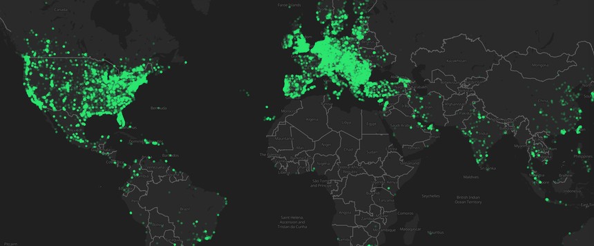 A world map showing a dense global network of green location markers, concentrated across North America, Europe, and Asia