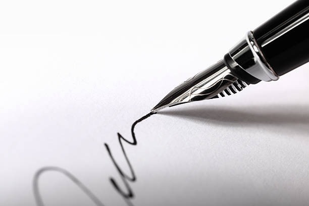 A fountain pen writing a signature